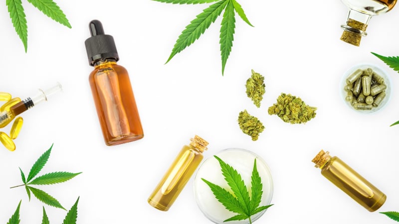 Various CBD Products and hemp leaf on white background